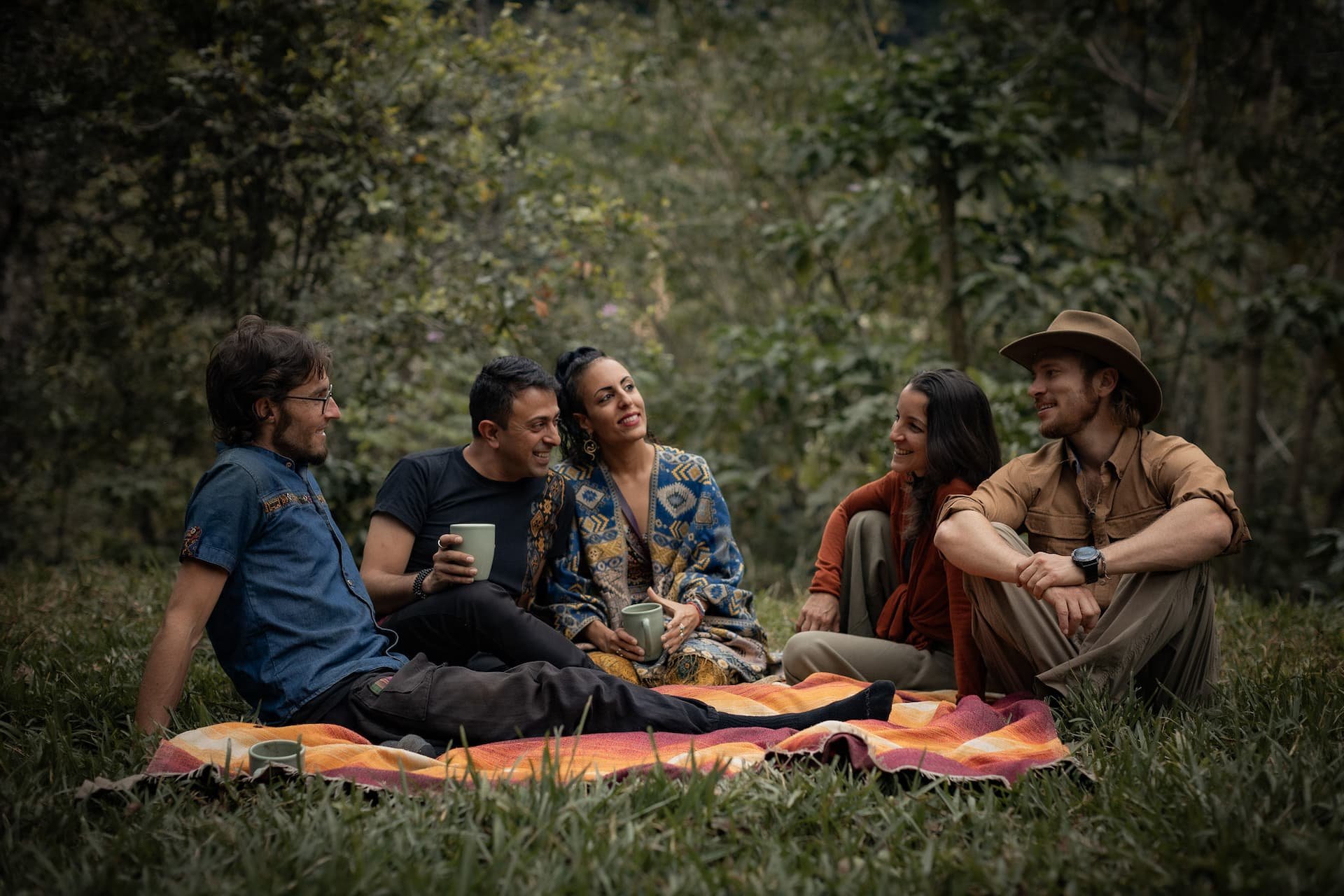 Friends chatting in a forest clearing