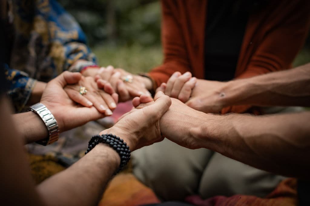 People holding hands, symbolizing community